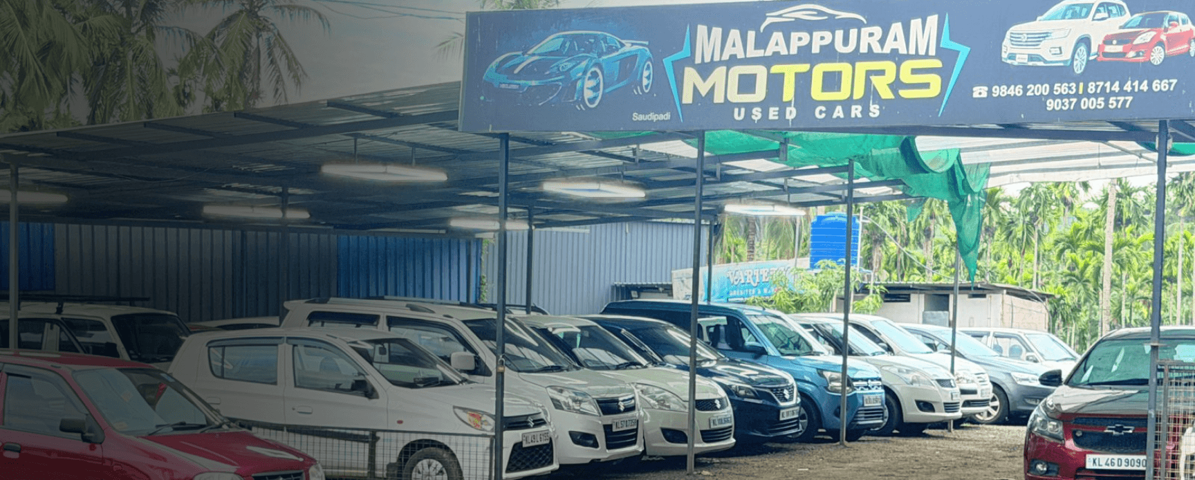 Malappuram Motors showroom with used cars parked outside